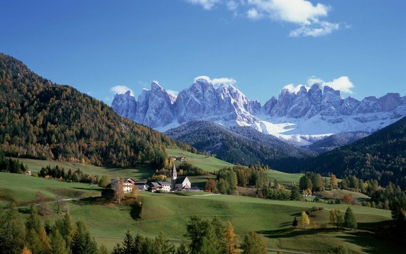 Alpine village with mountain backdrop