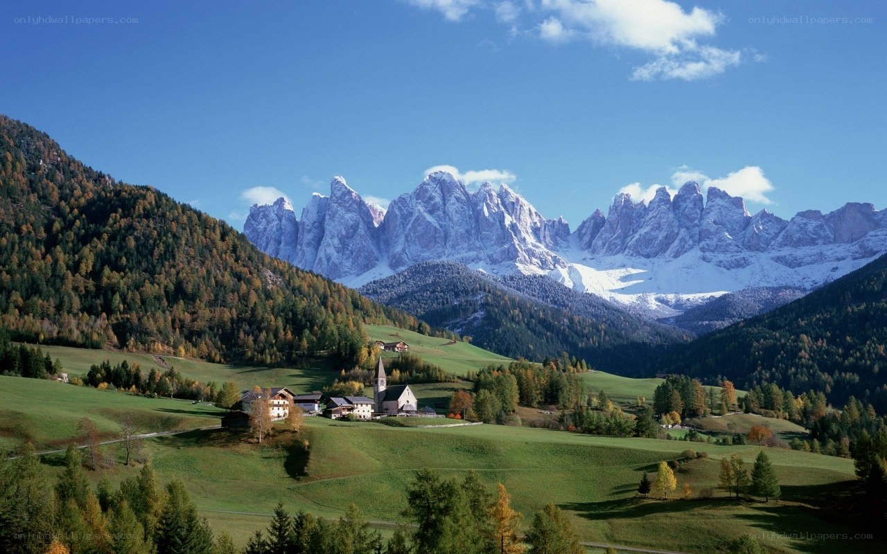 Alpine village with mountain backdrop