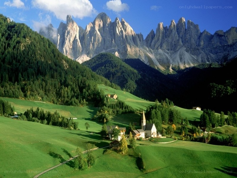 Alpine village with mountain backdrop