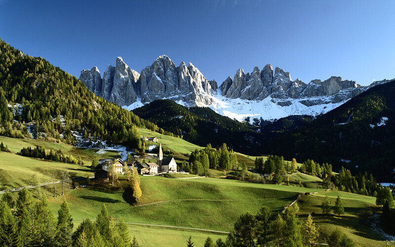 Alpine village with mountain backdrop