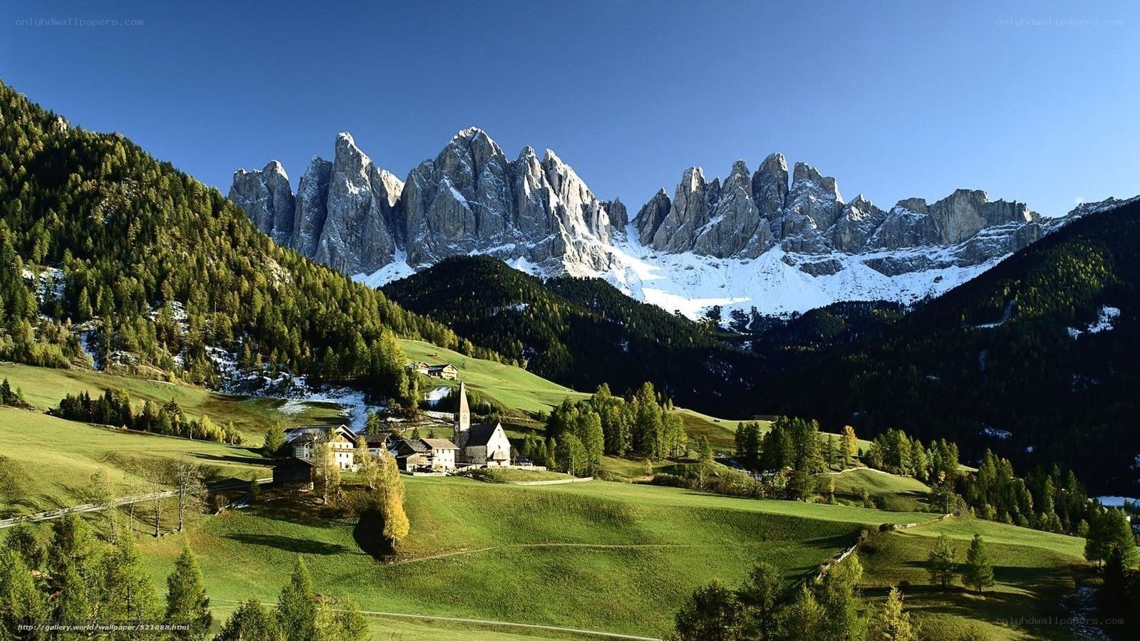 Alpine village with mountain backdrop