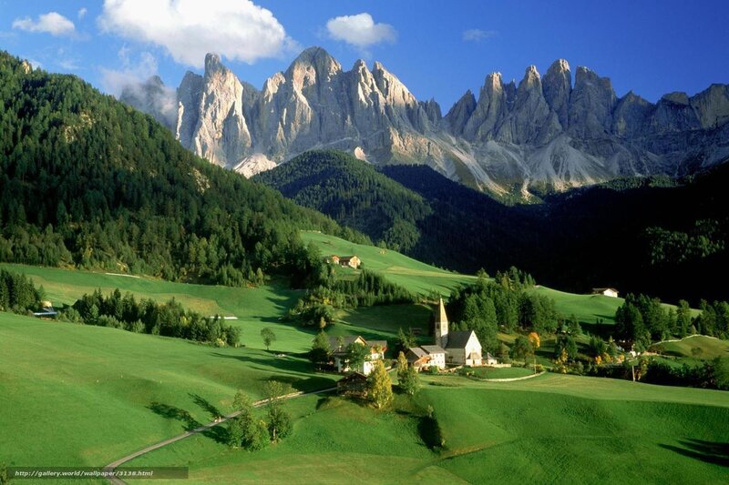 Alpine village with mountain backdrop