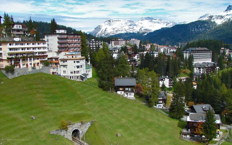 Alpine Village with Mountains — Green, Serene, Summer, Photograph