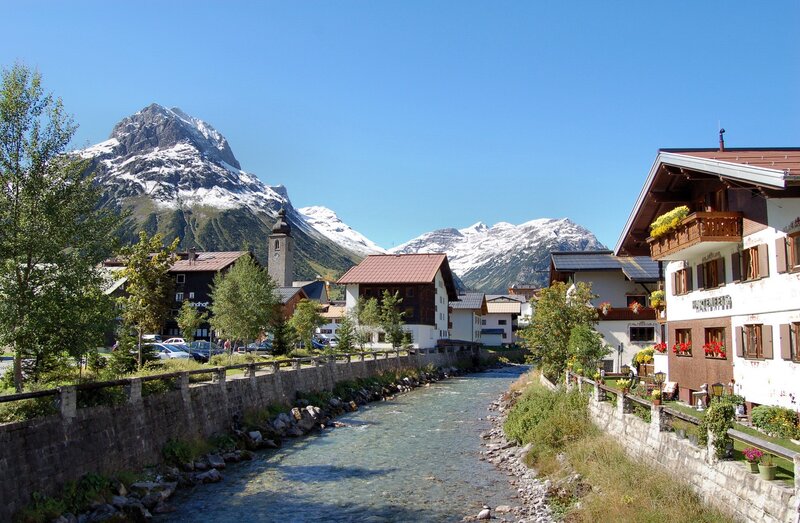 Alpine village with river and mountains