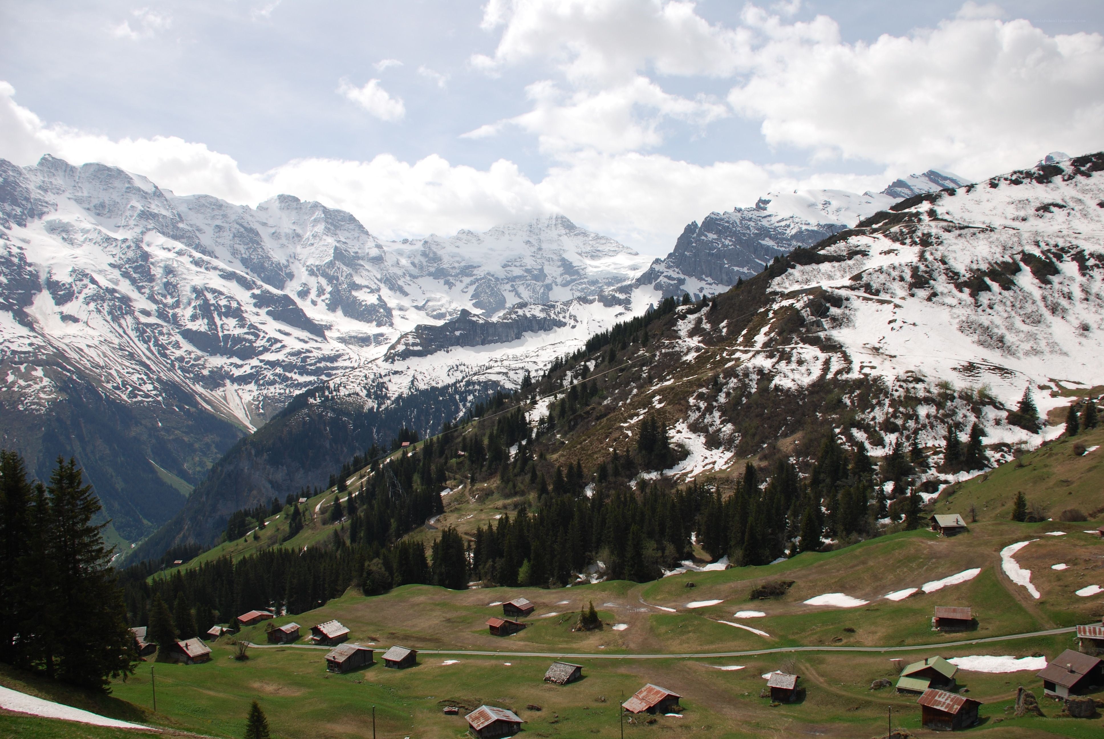 Alpine village with snow-capped mountains