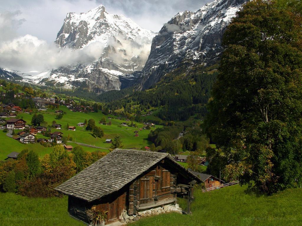 Alpine village with snow-capped mountains