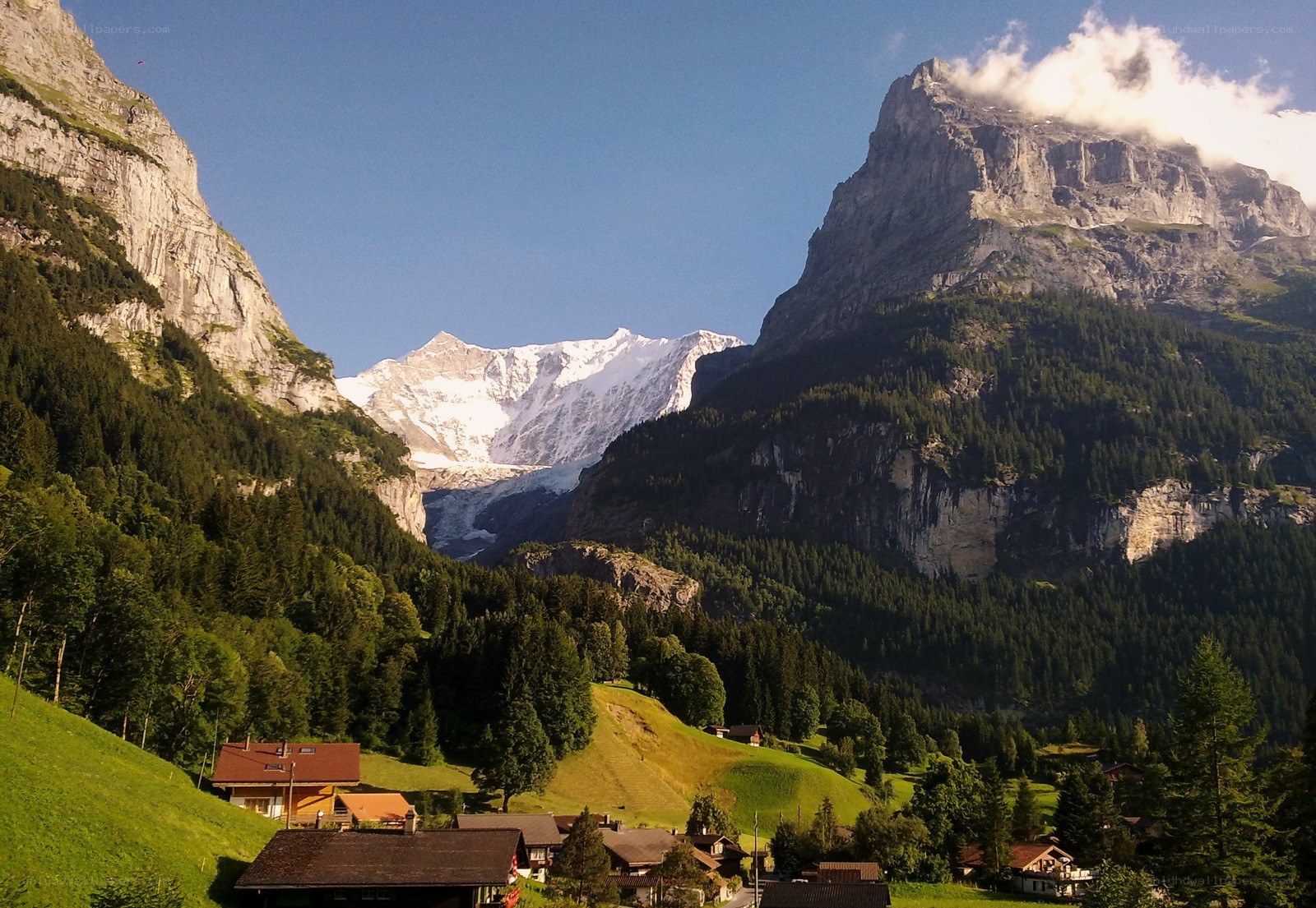 Alpine village with snow-capped peaks
