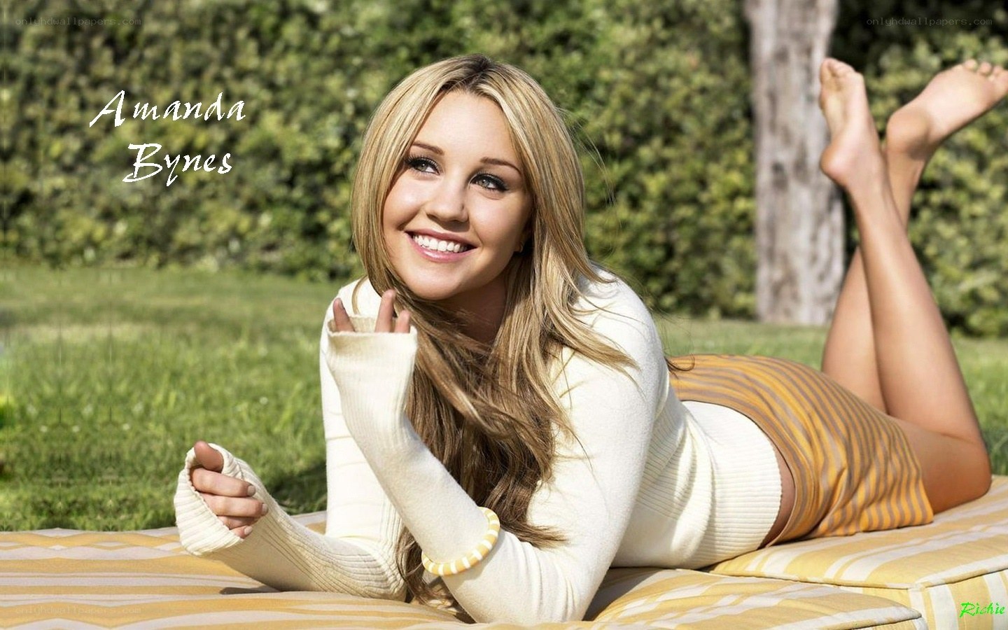 Amanda Bynes lying on a blanket