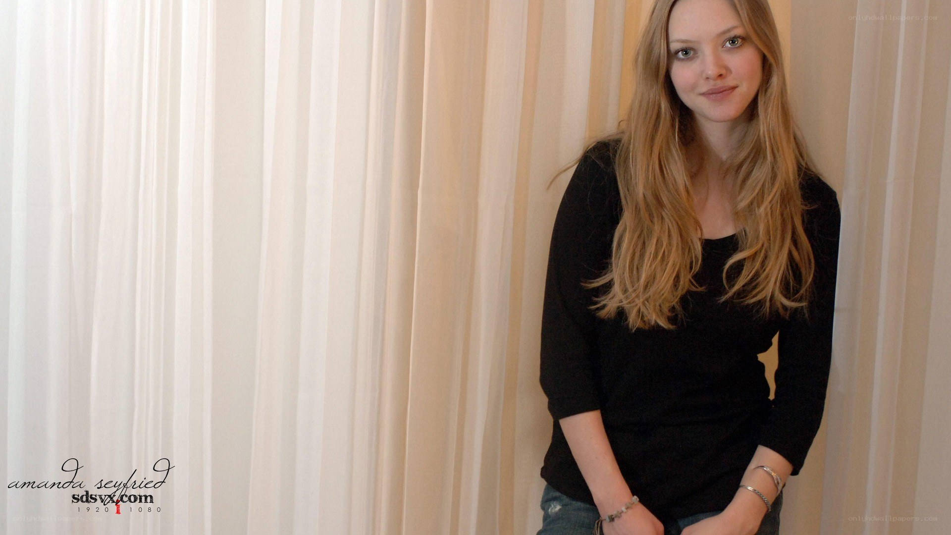 Amanda Seyfried in a black top