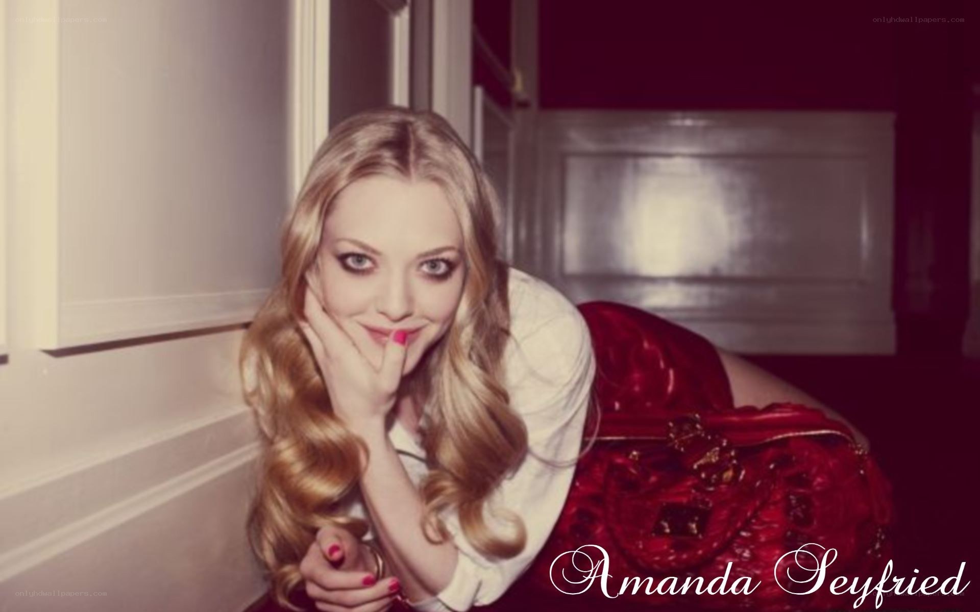 Amanda Seyfried posing in red