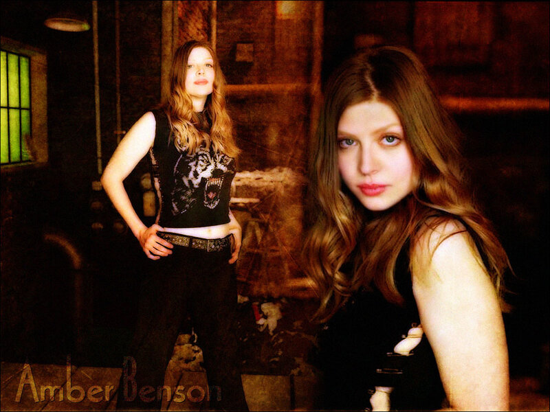 Amber Benson in a dimly lit room
