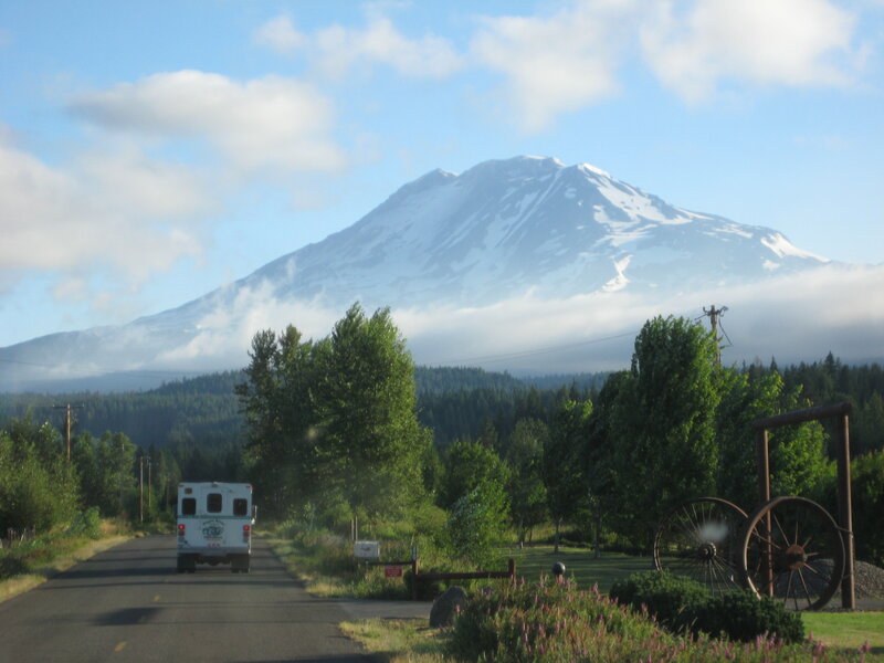 Ambulance on road near snow-capped mountain
