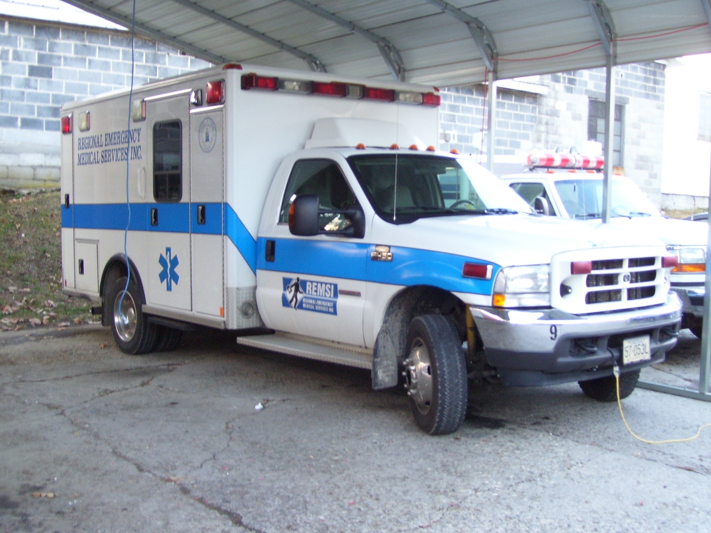 Ambulance parked under shelter