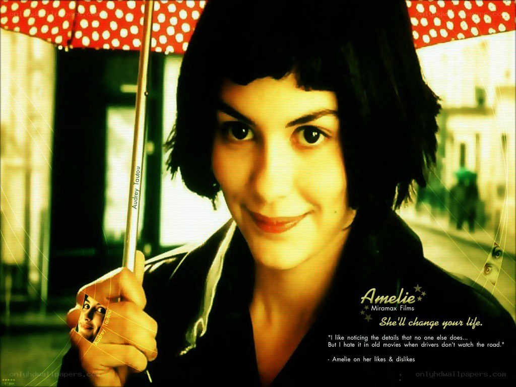 Amelie holding a polka-dot umbrella