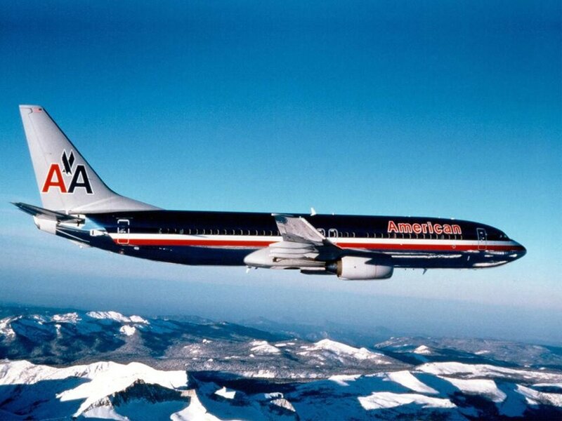 American Airlines plane flying over mountains
