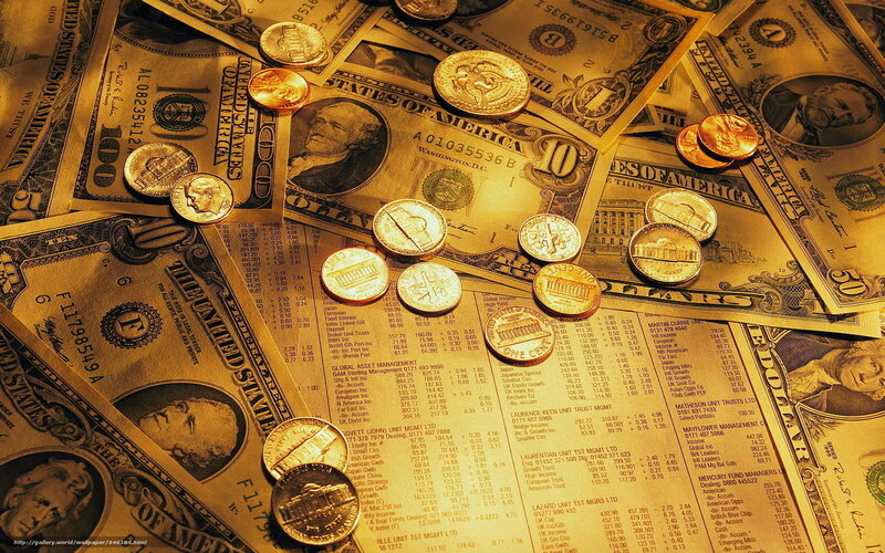 American currency scattered on table