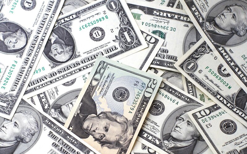 American dollar bills scattered