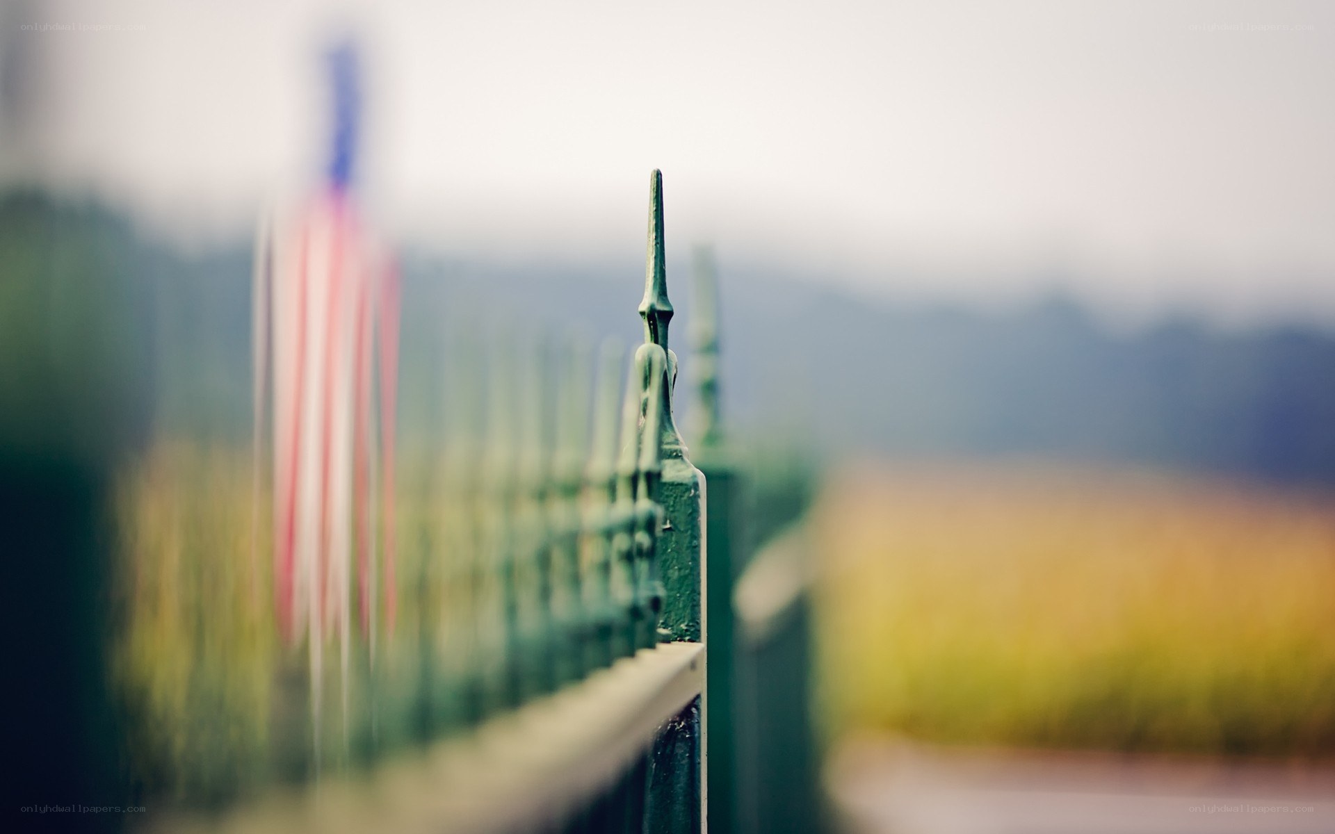 American flag behind a fence