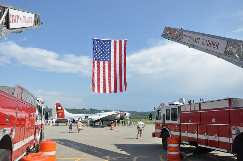American Flag Between Fire Trucks
