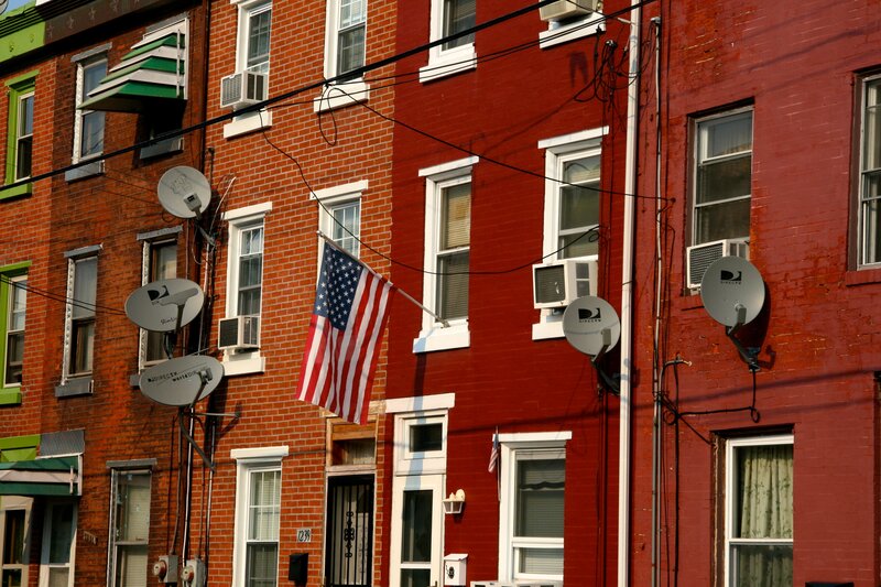 American flag on brick townhouses