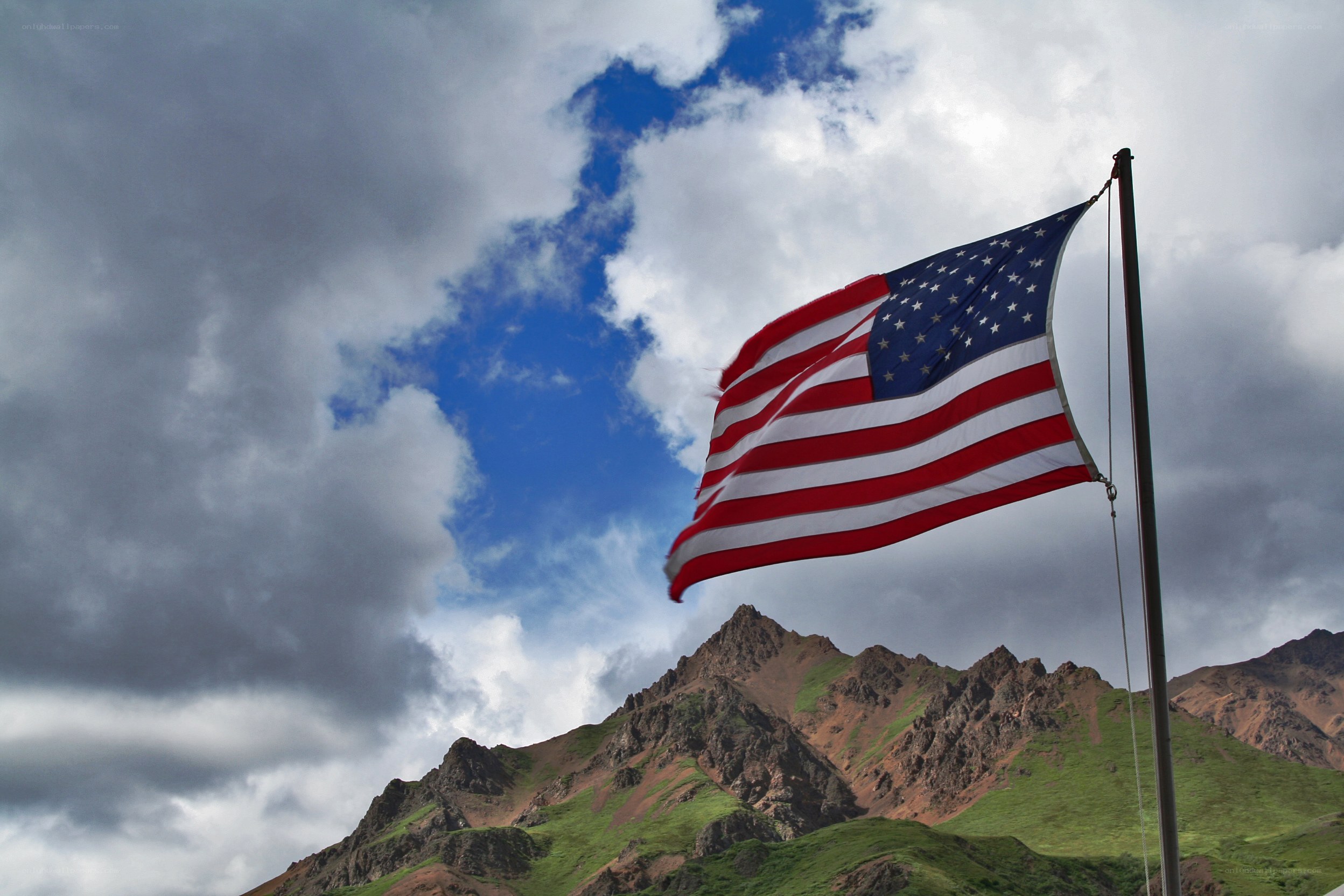 American flag on mountain peak