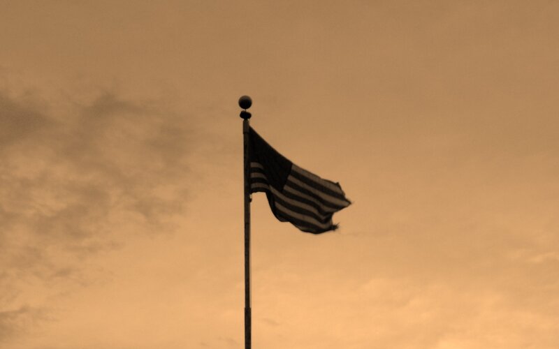 American Flag on Pole — Brown, Dramatic
