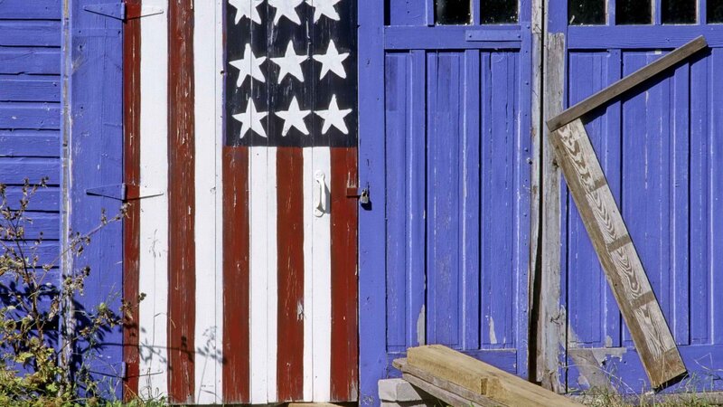 American flag painted on a barn door