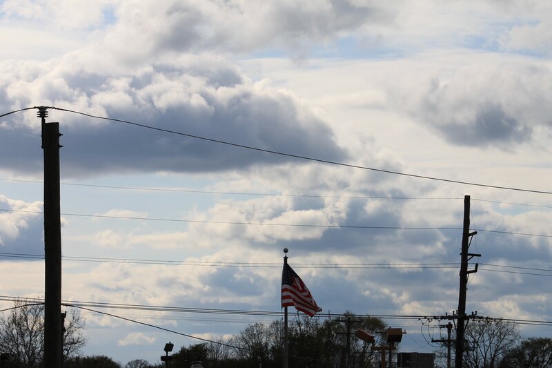 American flag under cloudy sky