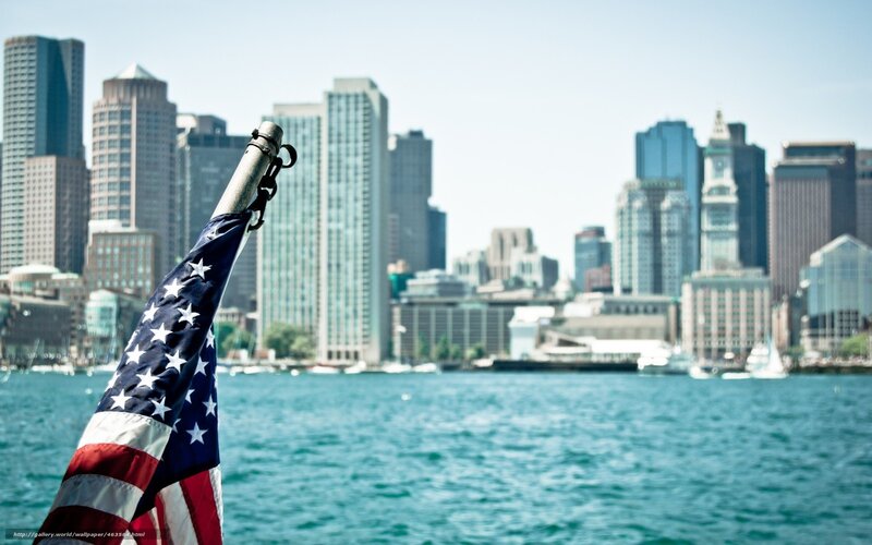 American flag with city skyline
