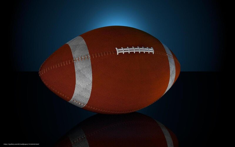 American football on dark background
