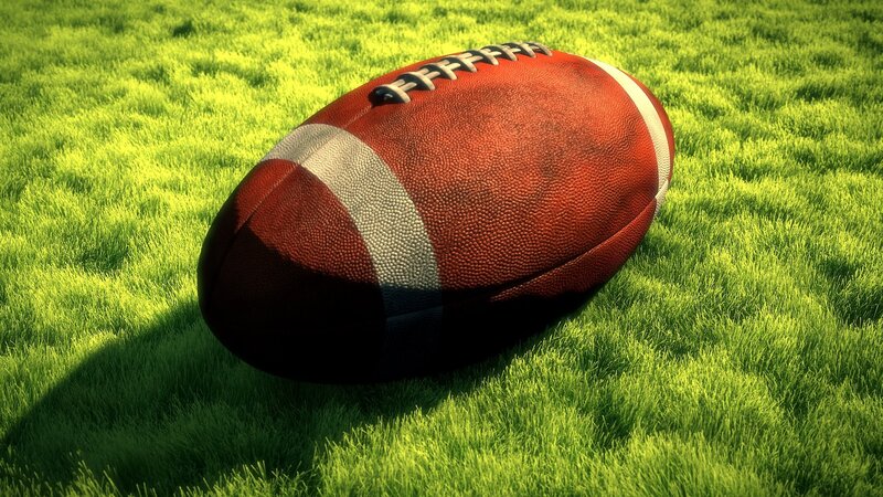 American football on grass field