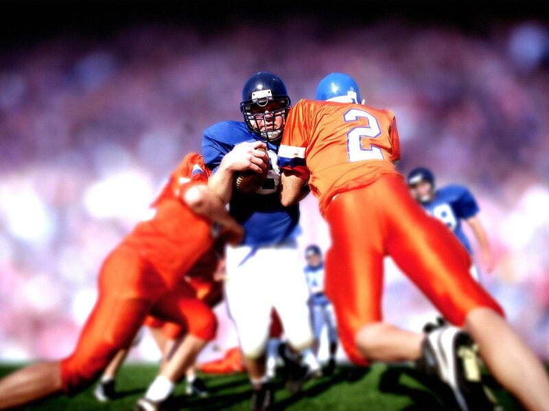 American football players in action