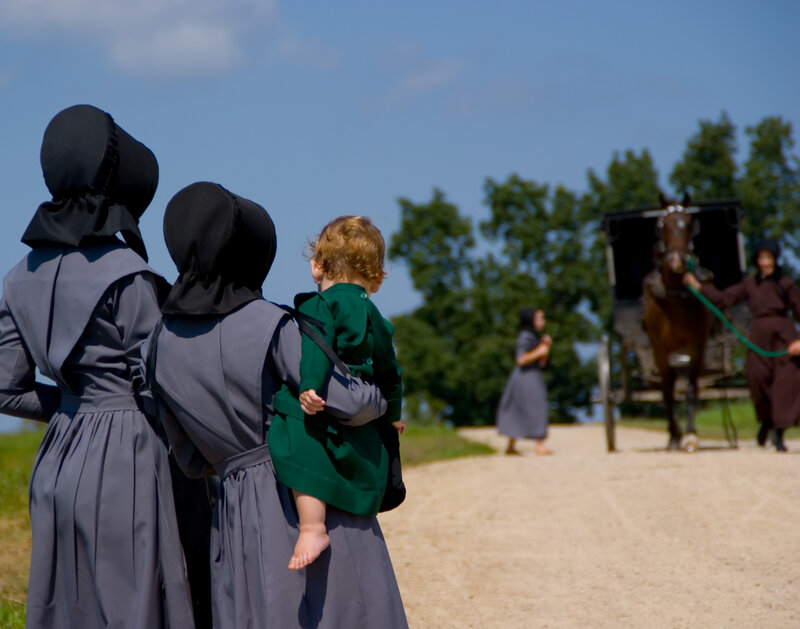 Amish family on a dirt road