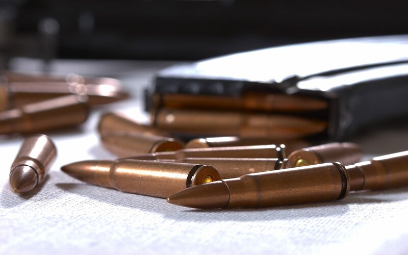 Ammunition on White Surface — Brown