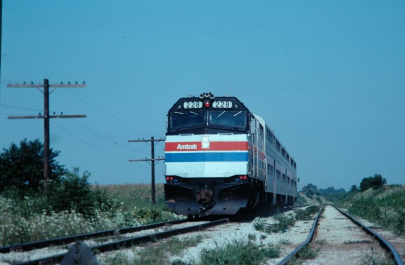 Amtrak train on rural tracks