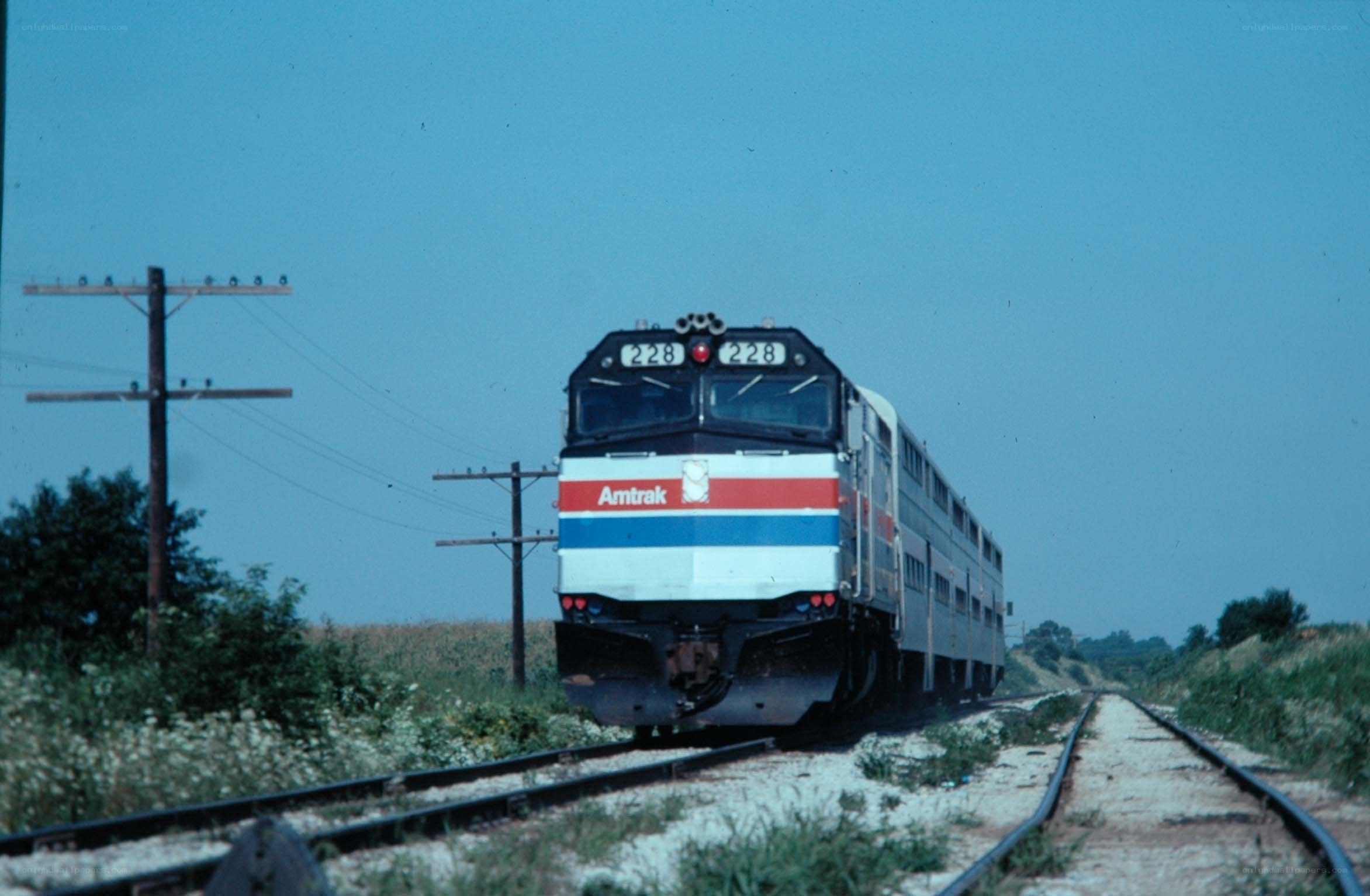 Amtrak train on rural tracks