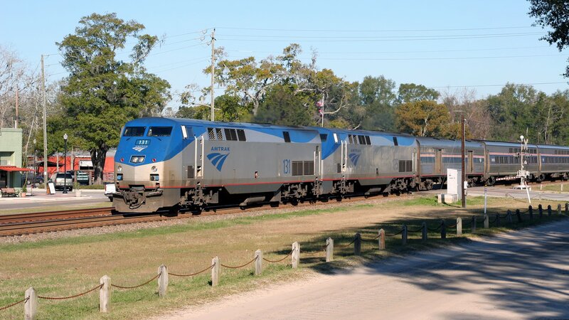 Amtrak Train on Tracks — Blue, Calm
