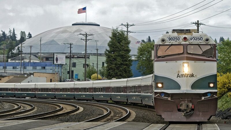 Amtrak Train on Tracks — Gray