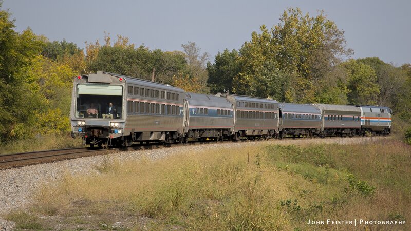 Amtrak Train on Tracks — Silver