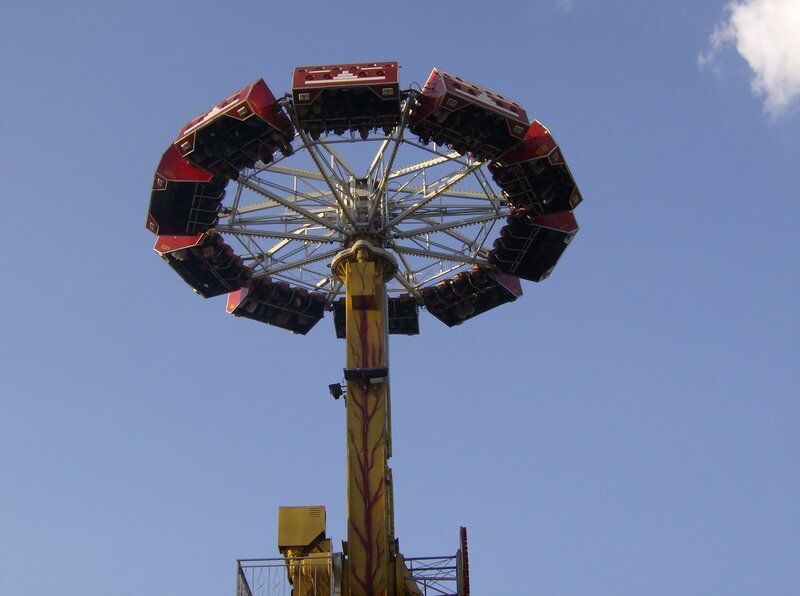 Amusement park ride against blue sky