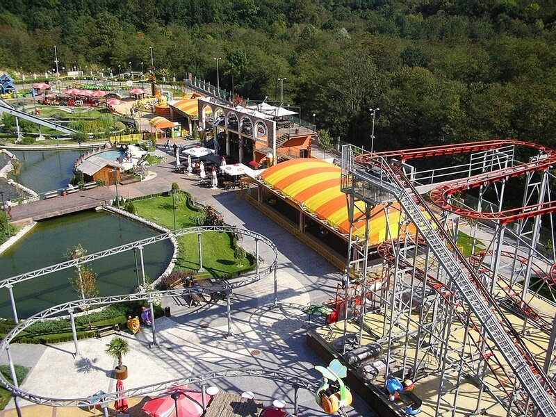 Amusement park with roller coaster