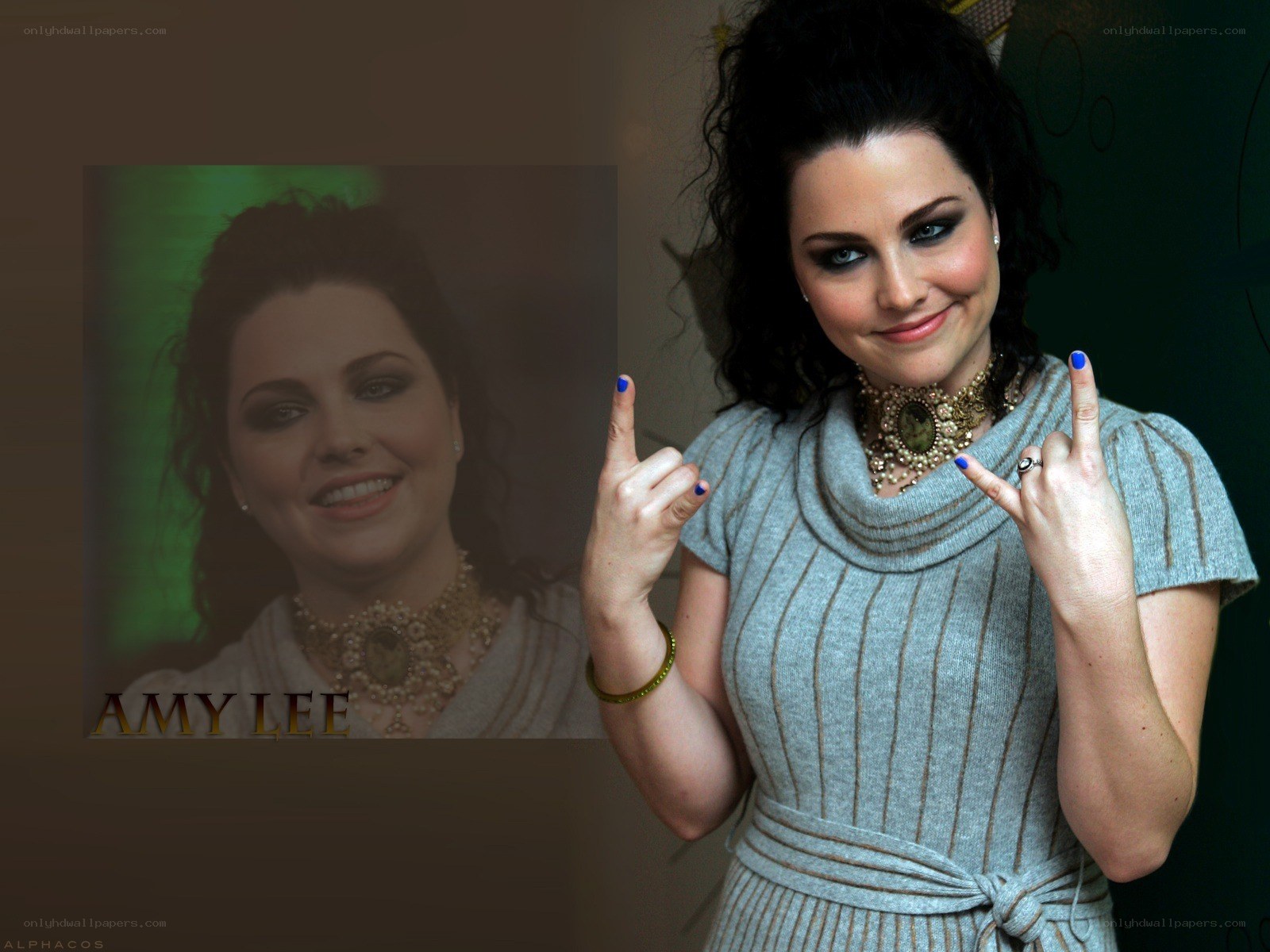 Amy Lee posing with rock hand signs