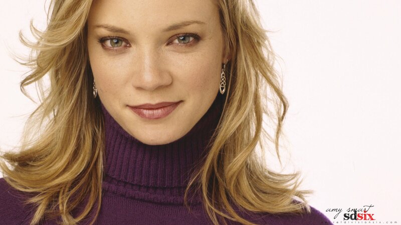 Amy Smart in purple turtleneck