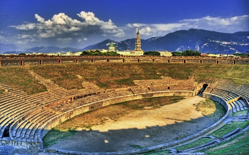 Ancient amphitheater with city view