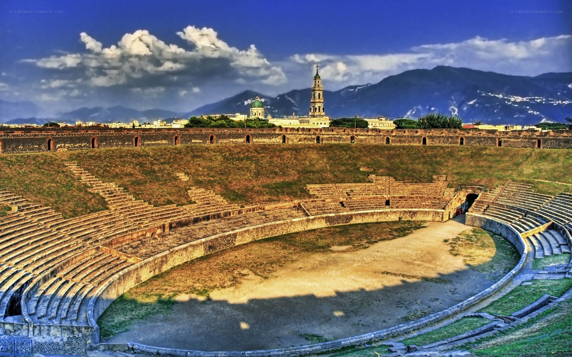 Ancient amphitheater with city view