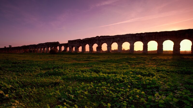 Ancient Aqueduct at Sunset — Purple