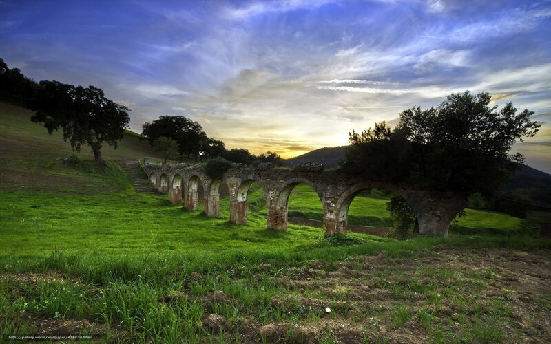 Ancient aqueduct at sunset