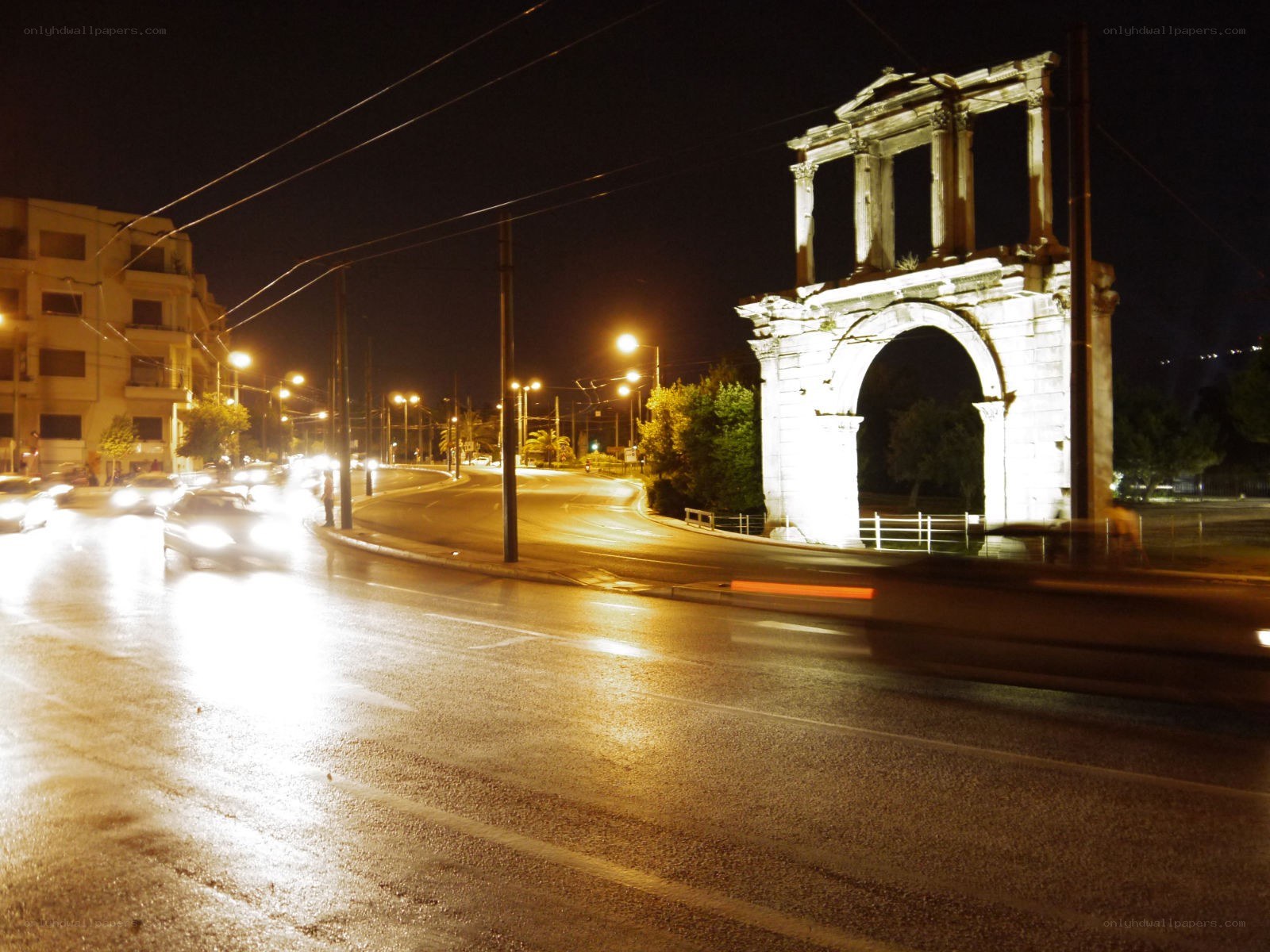 Ancient arch at night in a city