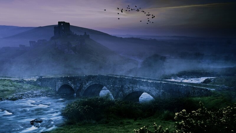 Ancient bridge and castle at dusk