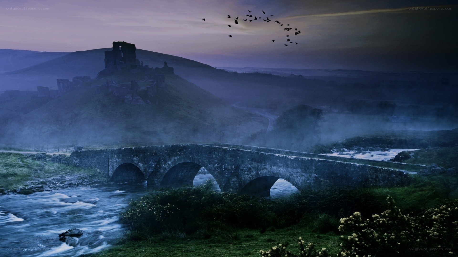 Ancient bridge and castle at dusk